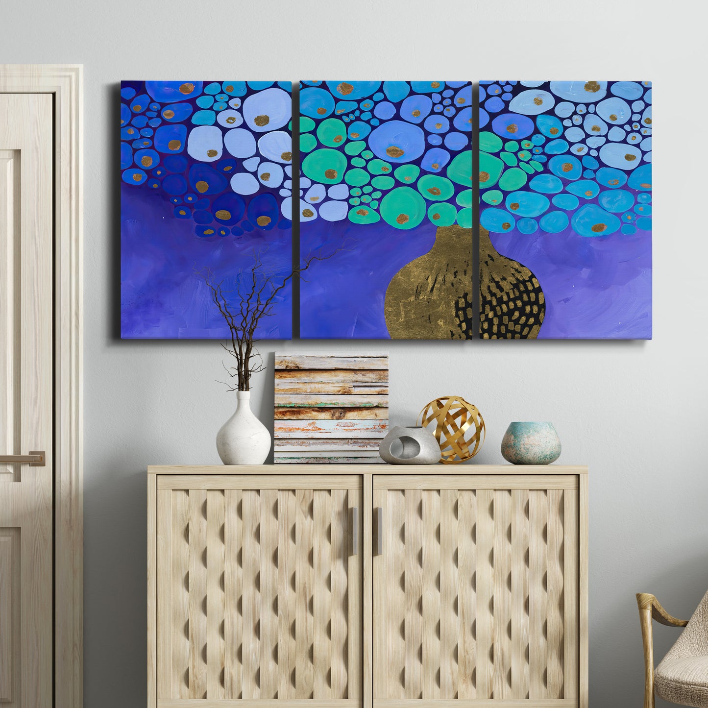 Three-panel canvas wall art featuring blue poppy floral abstraction, displayed above a cabinet in an entryway.