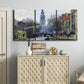 Three-panel canvas wall art featuring historic tower beside canal, displayed above a cabinet in an entryway.