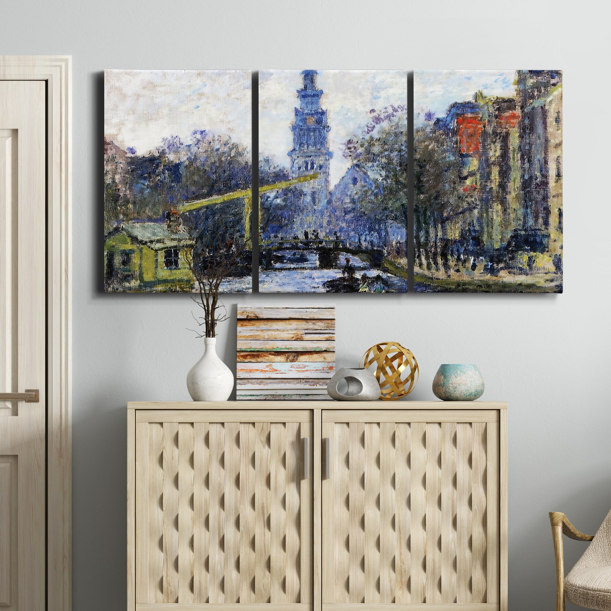 Three-panel canvas wall art featuring historic tower beside canal, displayed above a cabinet in an entryway.