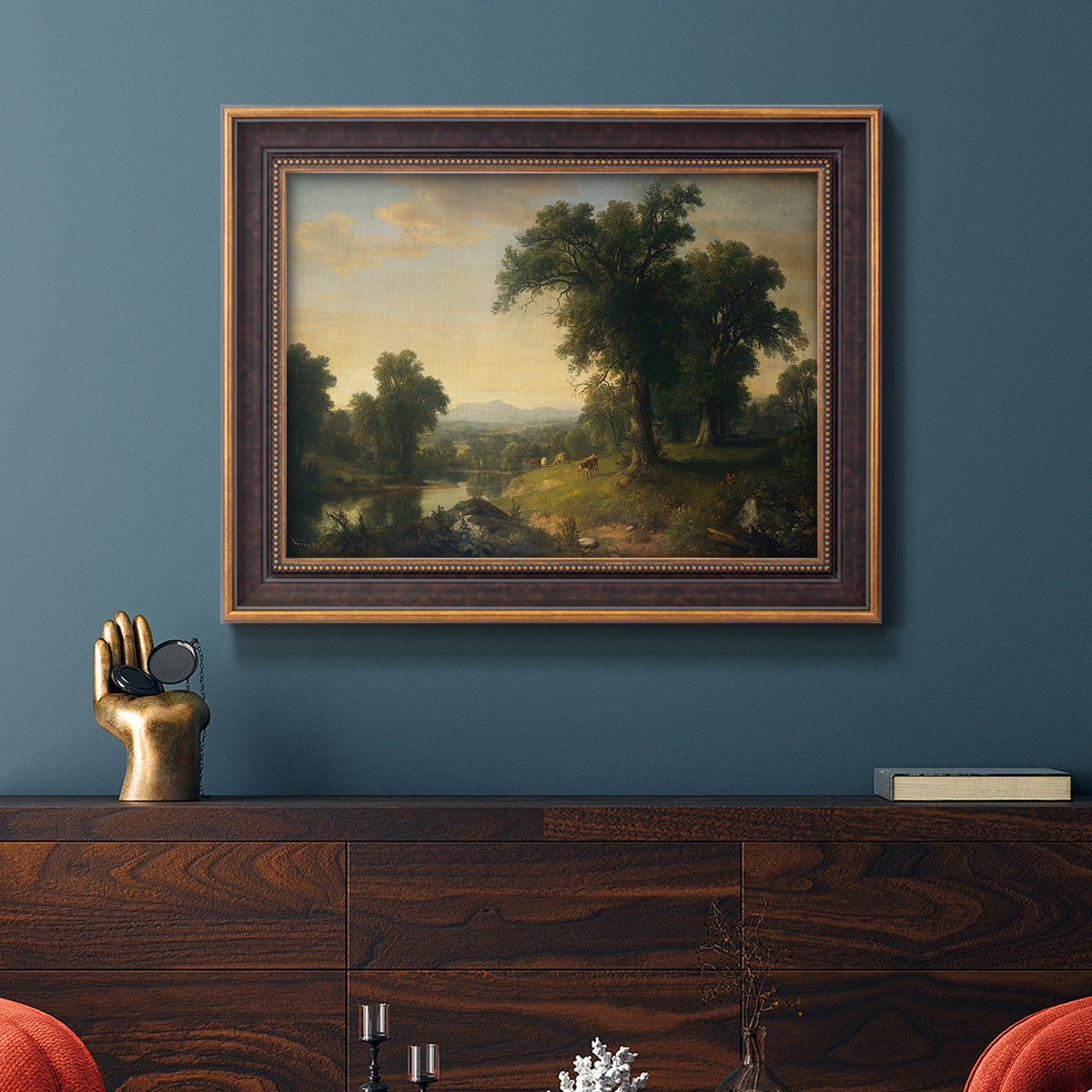 Traditional pastoral landscape painting by Asher Brown Durand in an ornate bronzed mahogany wood frame displayed in a dark-toned interior setting.