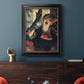 Impressionist portrait of a café singer by Edgar Degas in an ornate black frame with gilded inner detail displayed in a dark-toned interior setting.