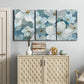 Three-panel canvas wall art featuring soft white floral abstraction, displayed above a cabinet in an entryway.
