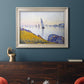 Impressionist coastal harbor at dusk by Paul Signac in an ornate champagne frame displayed in a dark-toned interior setting.