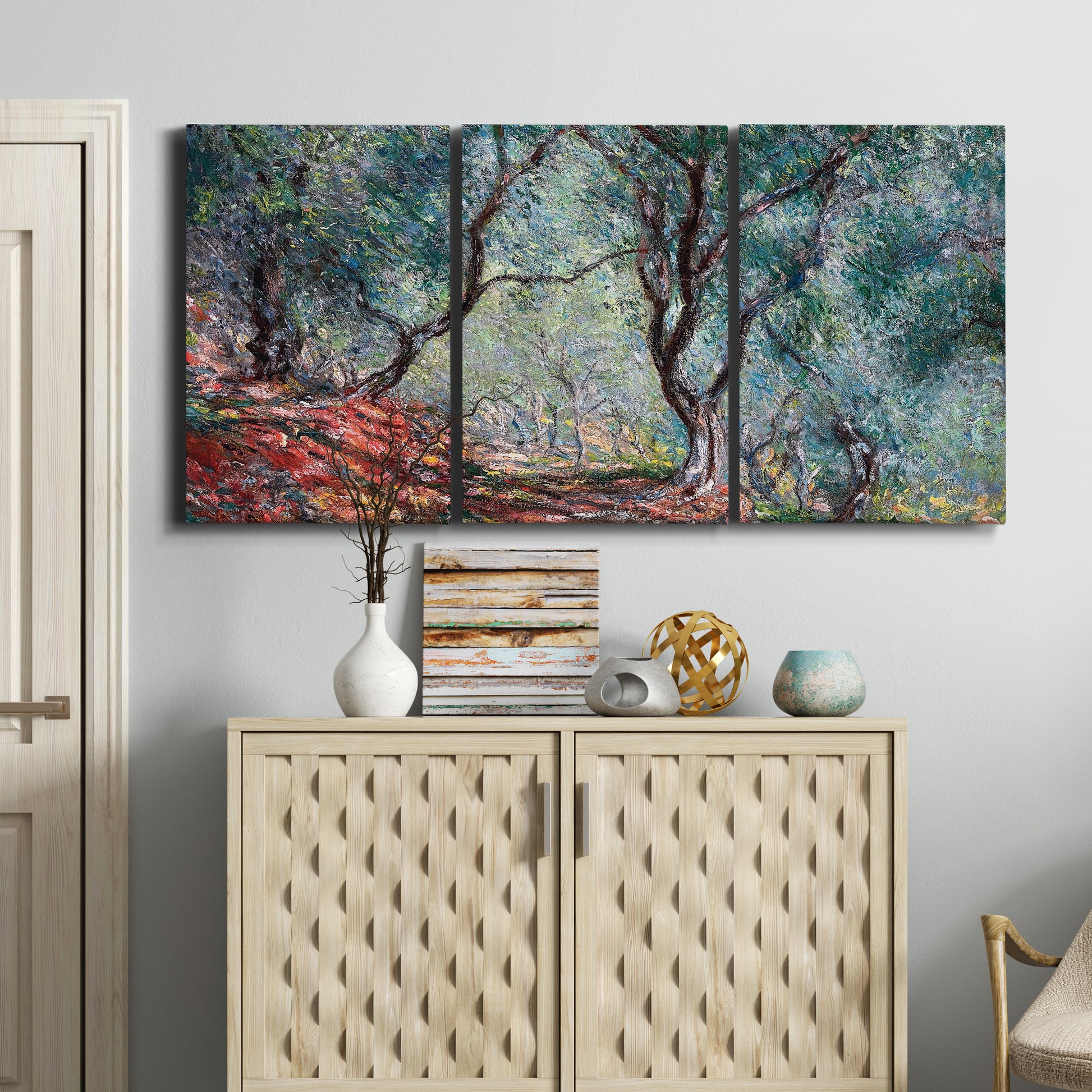Three-panel canvas wall art featuring olive trees in sunlit garden, displayed above a cabinet in an entryway.