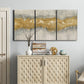 Three-panel canvas wall art featuring flowing abstract golden tones, displayed above a cabinet in an entryway.