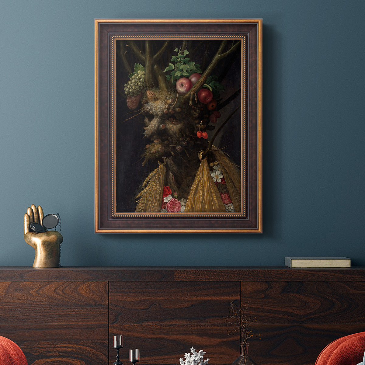 Surreal allegorical portrait representing the four seasons by Giuseppe Arcimboldo in an ornate bronzed mahogany wood frame displayed in a dark-toned interior setting.