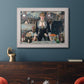 Iconic impressionist café bar scene by Édouard Manet in an ornate weathered white frame displayed in a dark-toned interior setting.