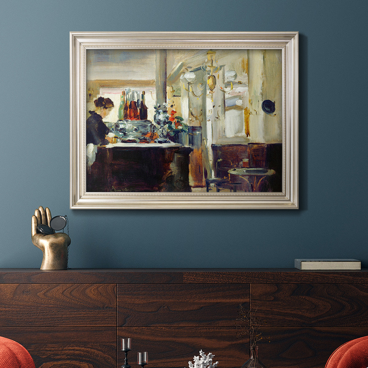 Impressionist café still life scene by Édouard Manet in an ornate champagne frame displayed in a dark-toned interior setting.