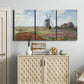 Three-panel canvas wall art featuring tulip fields with windmill, displayed above a cabinet in an entryway.