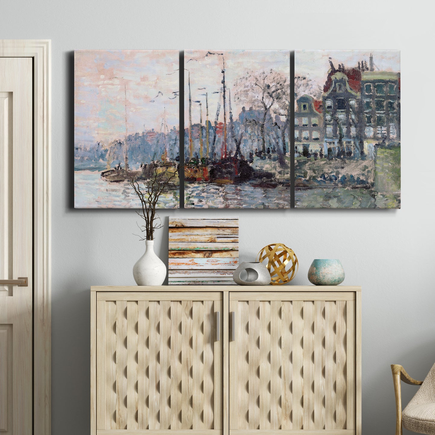 Three-panel canvas wall art featuring historic canal view with boats, displayed above a cabinet in an entryway.