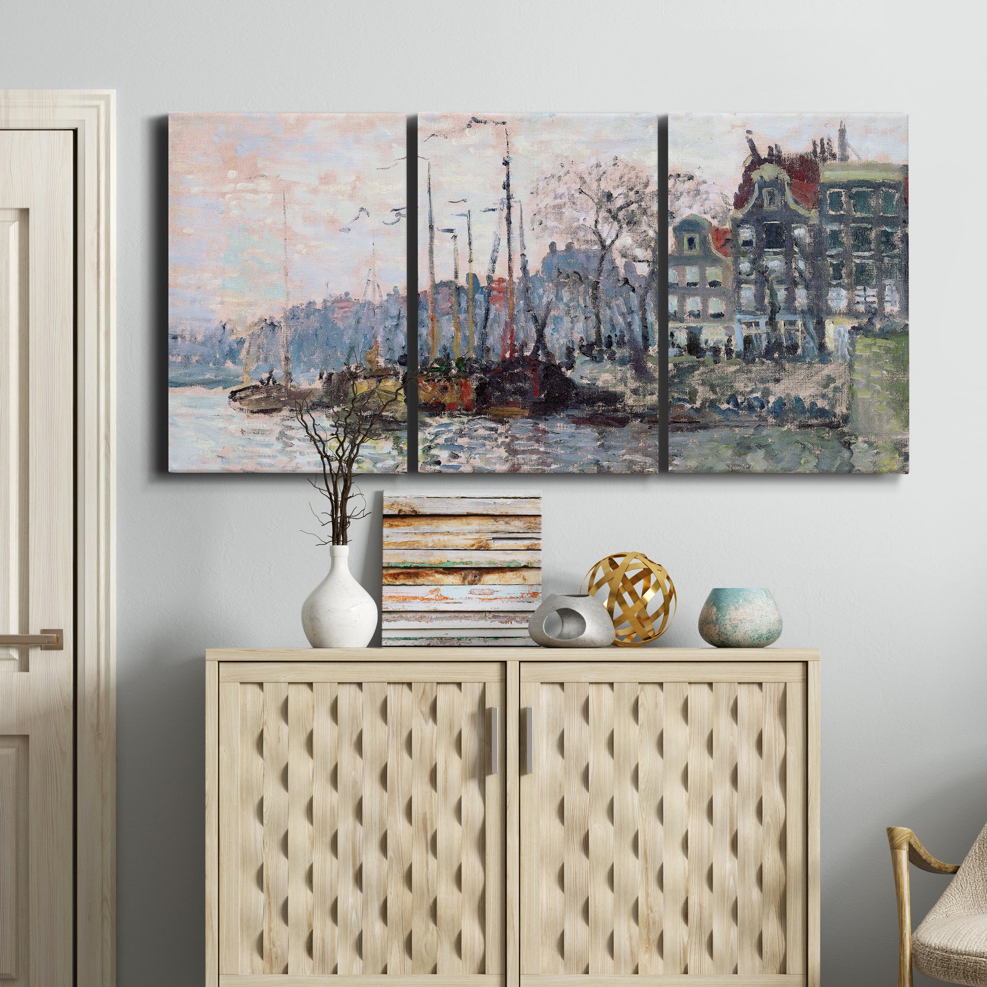 Three-panel canvas wall art featuring historic canal view with boats, displayed above a cabinet in an entryway.