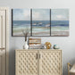 Three-panel canvas wall art featuring shore birds searching along beach, displayed above a cabinet in an entryway.