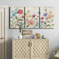 Three-panel canvas wall art featuring delicate wildflower illustration, displayed above a cabinet in an entryway.