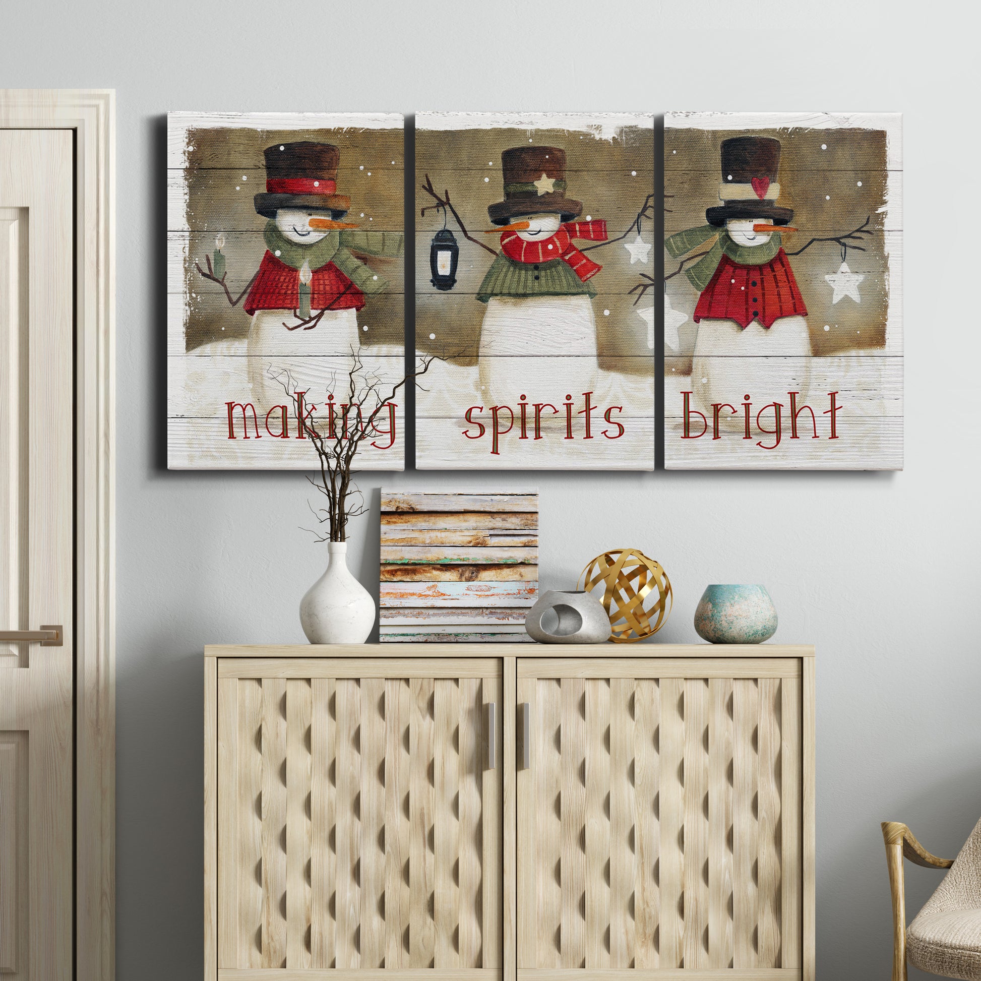 Three-panel canvas wall art featuring misty harbor sunrise with boats, displayed above a cabinet in an entryway.