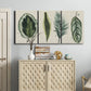 Three-panel canvas wall art featuring botanical palm leaf illustration, displayed above a cabinet in an entryway.