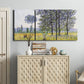 Three-panel canvas wall art featuring sunlight filtering through tall poplars, displayed above a cabinet in an entryway.