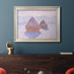 Impressionist winter haystack scene with sunlight by Claude Monet in an ornate champagne frame displayed in a dark-toned interior setting.