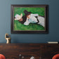 Impressionist outdoor portrait of two girls by John Singer Sargent in an ornate black frame with gilded inner detail displayed in a dark-toned interior setting.