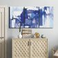 Three-panel canvas wall art featuring abstract urban street scene, displayed above a cabinet in an entryway.