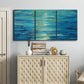 Three-panel canvas wall art featuring deep blue ocean water abstraction, displayed above a cabinet in an entryway.