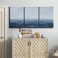 Three-panel canvas wall art featuring grayscale seascape with horizon, displayed above a cabinet in an entryway.