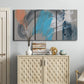 Three-panel canvas wall art featuring playful abstract mark making, displayed above a cabinet in an entryway.