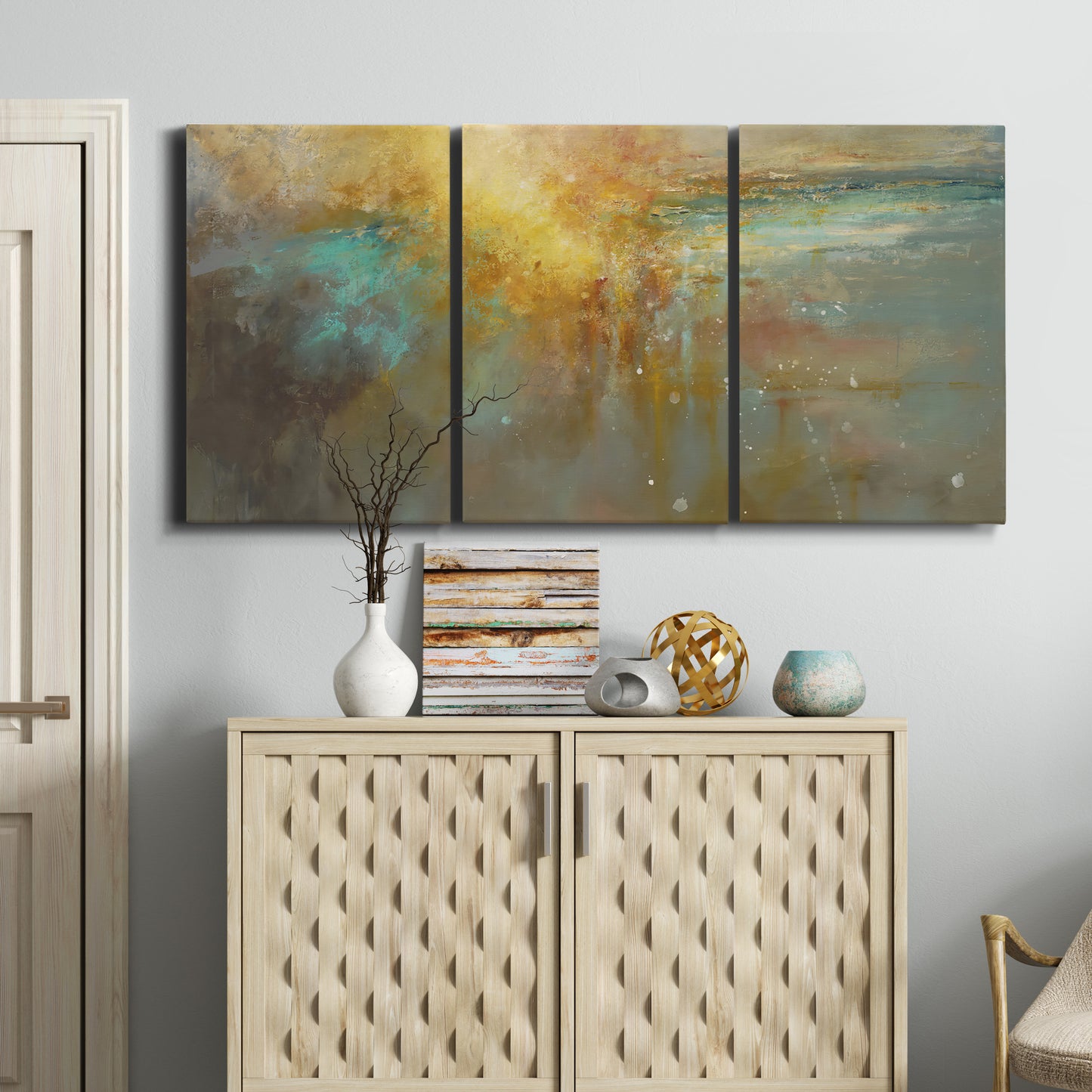 Three-panel canvas wall art featuring muted abstract river inspired tones, displayed above a cabinet in an entryway.