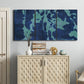 Three-panel canvas wall art featuring abstract floral shapes, displayed above a cabinet in an entryway.