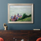 Impressionist coastal villas landscape by Gustave Caillebotte in an ornate champagne frame displayed in a dark-toned interior setting.