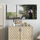 Three-panel canvas wall art featuring garden house beside river, displayed above a cabinet in an entryway.