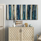 Three-panel canvas wall art featuring vertical blue abstract streaks, displayed above a cabinet in an entryway.