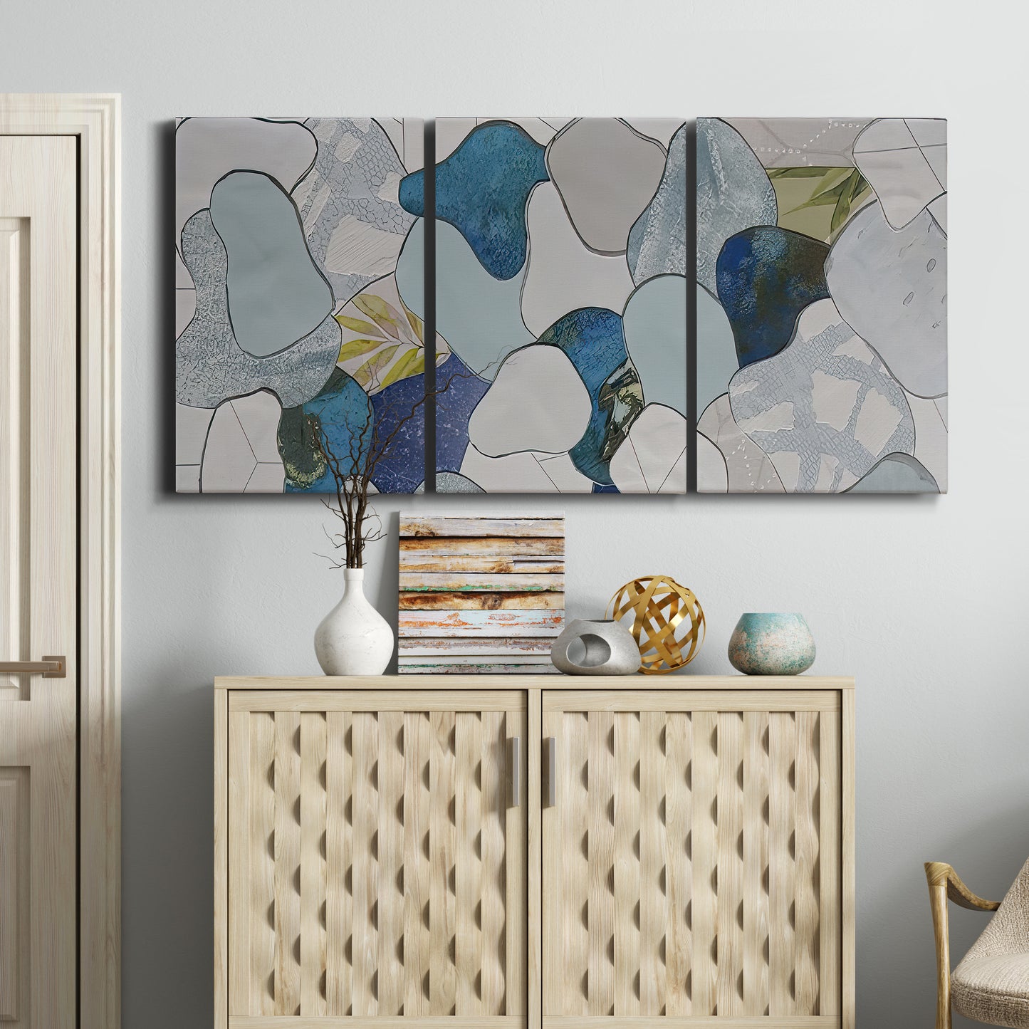 Three-panel canvas wall art featuring mid century geometric pink abstraction, displayed above a cabinet in an entryway.