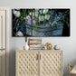 Three-panel canvas wall art featuring colorful wild tulips in bloom, displayed above a cabinet in an entryway.