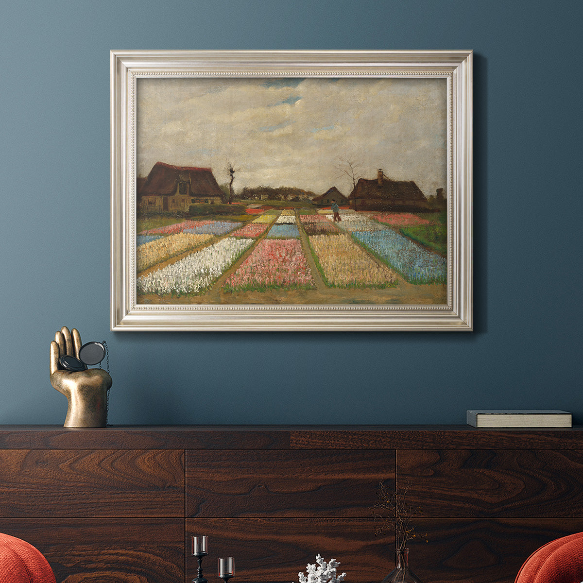Impressionist Dutch bulb field landscape by Vincent van Gogh in an ornate champagne frame displayed in a dark-toned interior setting.