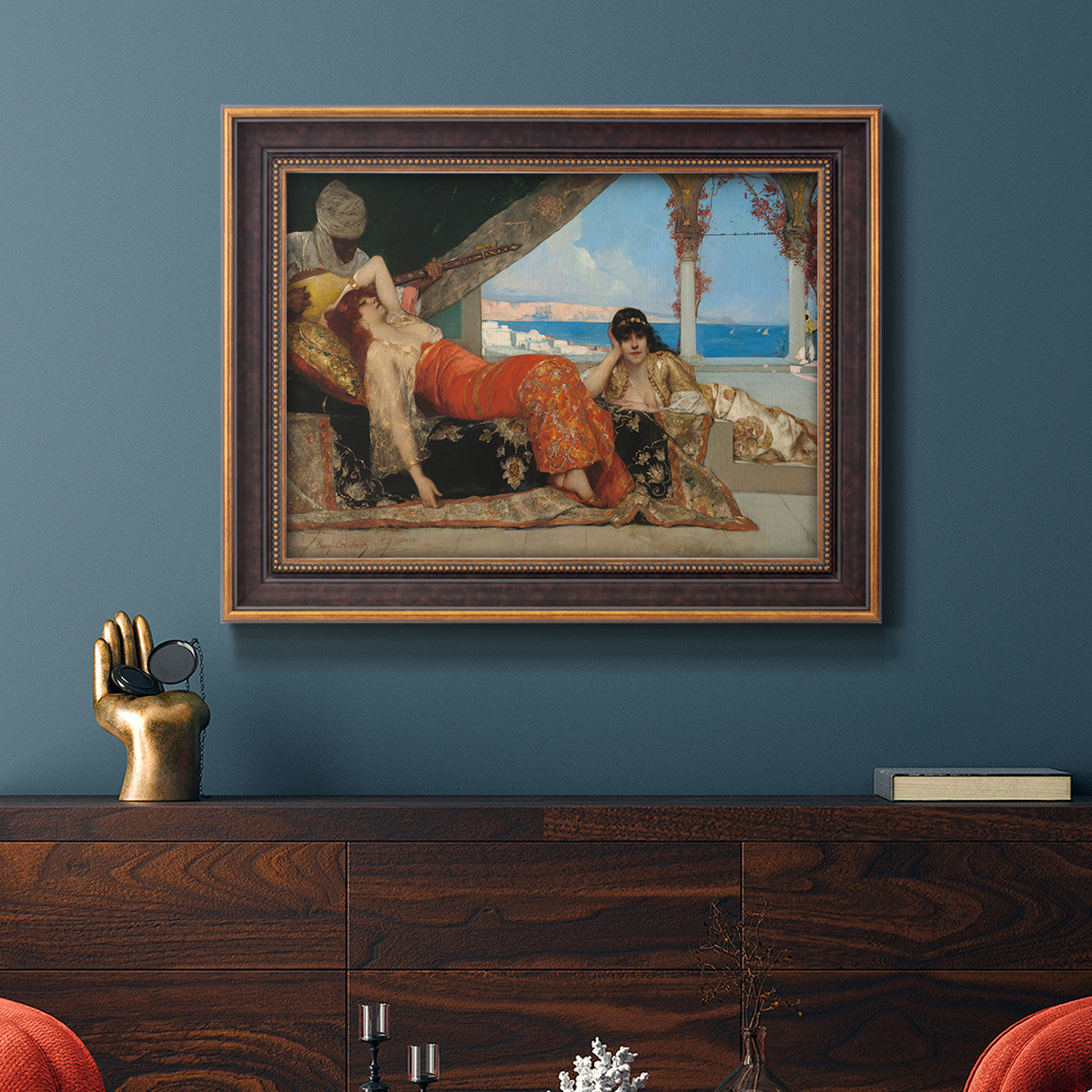 Orientalist portrait scene by Jean-Joseph Benjamin-Constant in an ornate bronzed mahogany wood frame displayed in a dark-toned interior setting.