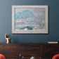 Impressionist coastal village landscape in Norway by Claude Monet in an ornate weathered white frame displayed in a dark-toned interior setting.