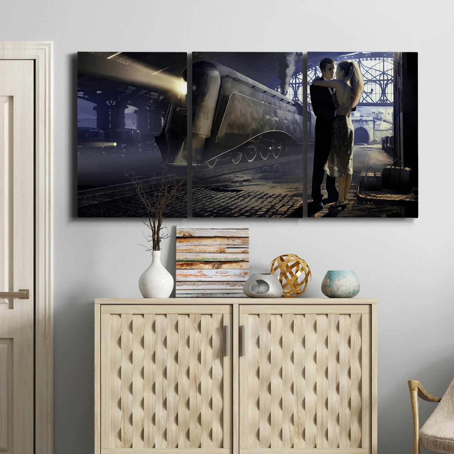 Three-panel canvas wall art featuring couple kissing at train station, displayed above a cabinet in an entryway.