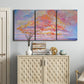 Three-panel canvas wall art featuring peaceful tropical inspired landscape, displayed above a cabinet in an entryway.