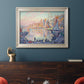 Impressionist Mediterranean harbor painting by Paul Signac in an ornate champagne frame displayed in a dark-toned interior setting.
