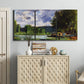 Three-panel canvas wall art featuring riverbank landscape near village, displayed above a cabinet in an entryway.