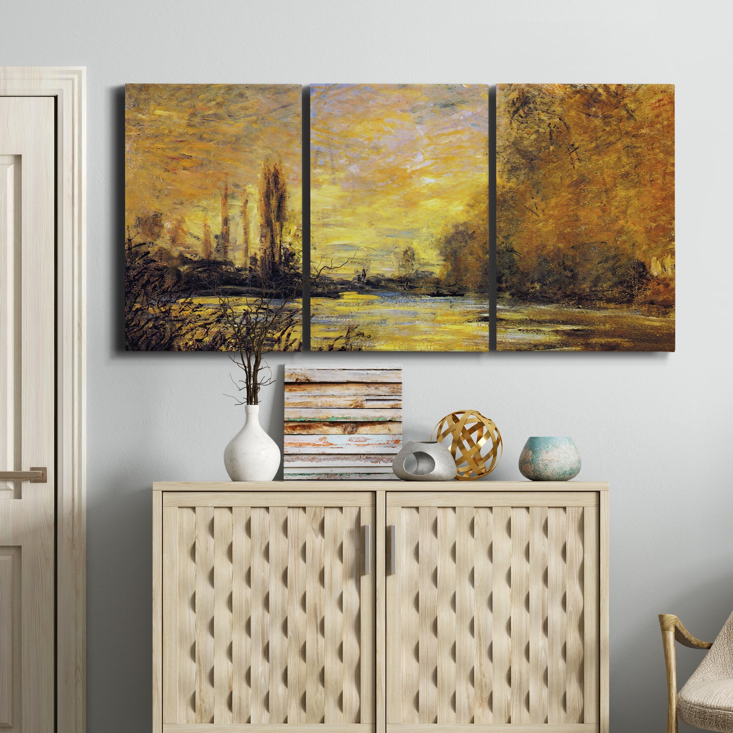 Three-panel canvas wall art featuring quiet river branch landscape, displayed above a cabinet in an entryway.