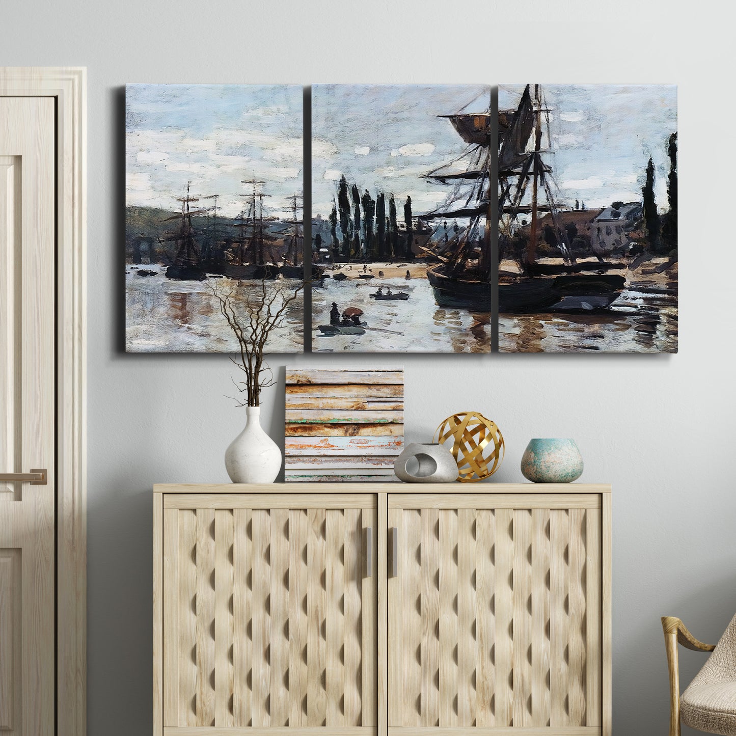 Three-panel canvas wall art featuring harbor scene with boats and quays, displayed above a cabinet in an entryway.