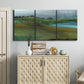 Three-panel canvas wall art featuring quiet contemplative landscape scene, displayed above a cabinet in an entryway.