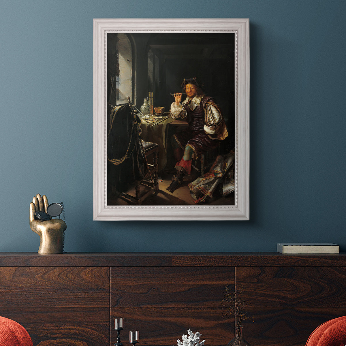 Classical portrait of a soldier smoking a pipe by Frans van Mieris the Elder in an ornate weathered white frame displayed in a dark-toned interior setting.