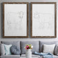 Set of two walnut barnwood framed canvas prints depicting paired minimalist livestock sketches with fine gray lines, white backgrounds, and quiet farm-animal profiles above a sofa in a contemporary living room.