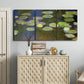 Three-panel canvas wall art featuring yellow and white water lilies, displayed above a cabinet in an entryway.