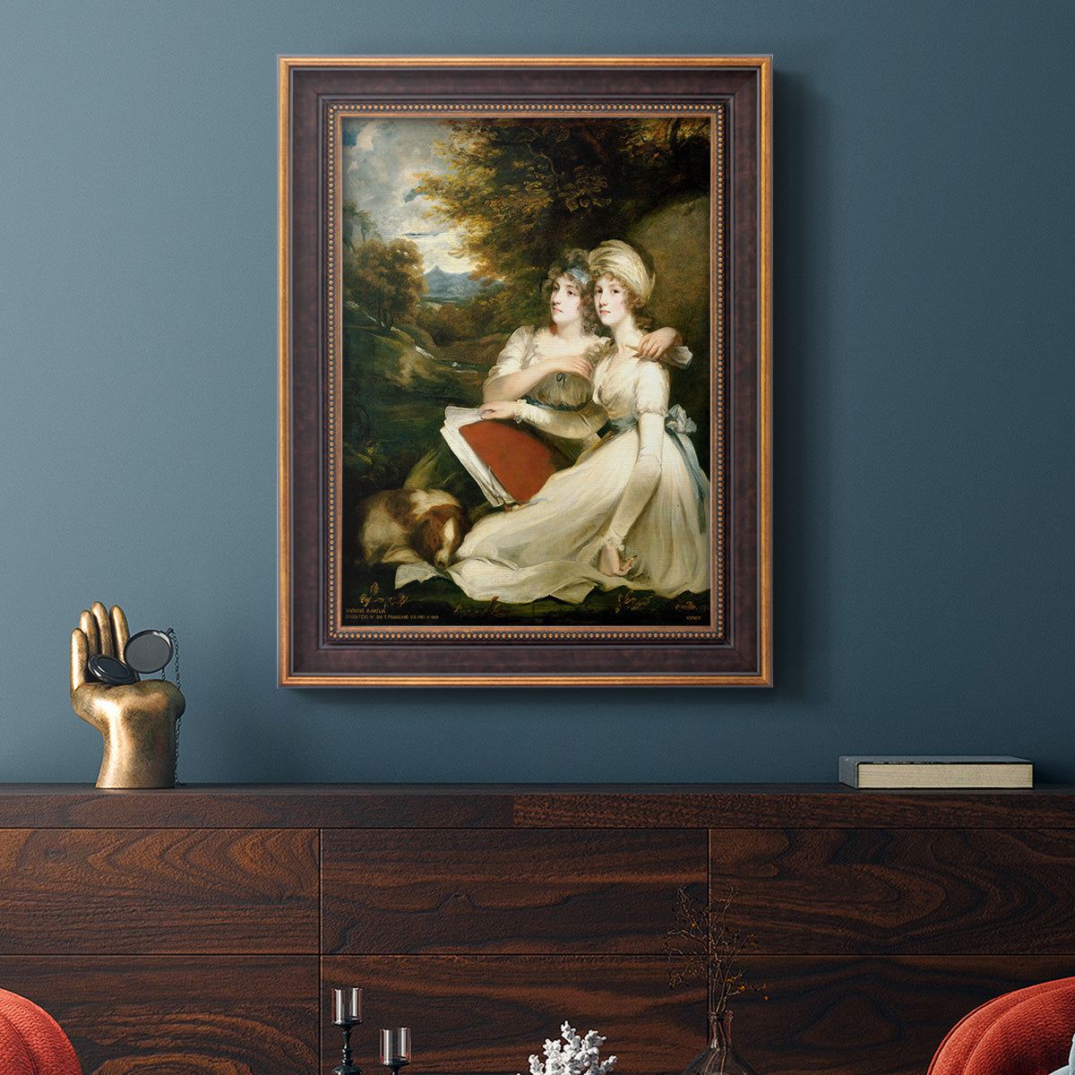 Classical portrait of the Frankland sisters by John Hoppner in an ornate bronzed mahogany wood frame displayed in a dark-toned interior setting.