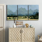 Three-panel canvas wall art featuring rural farmland landscape in watercolor, displayed above a cabinet in an entryway.