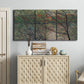 Three-panel canvas wall art featuring spring countryside with fresh foliage, displayed above a cabinet in an entryway.