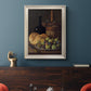 Realist still life with figs and bread by Luis Meléndez in an ornate champagne frame displayed in a dark-toned interior setting.